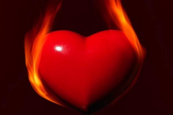 Heart surrounded by flames